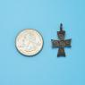 Cross size next to a Quarter