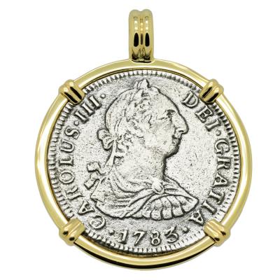 El Cazador treasure coin in gold pendant