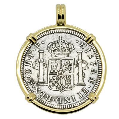 El Cazador treasure coin in gold pendant